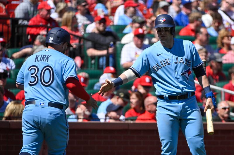 Apr 2, 2023; St. Louis, Missouri, USA;  Toronto Blue Jays designated hitter Alejandro Kirk (30) is congratulated by catcher Danny Jansen (9) after scoring against the St. Louis Cardinals during the second inning at Busch Stadium. Mandatory Credit: Jeff Curry-USA TODAY Sports