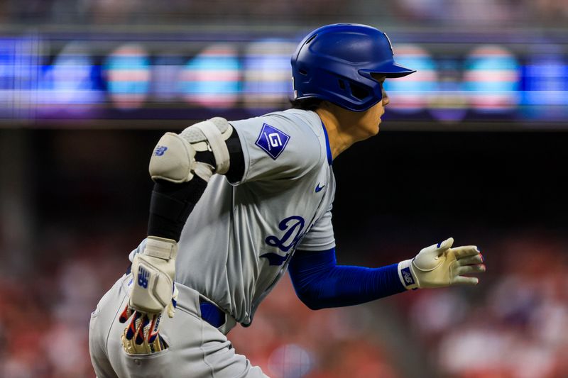 May 25, 2024; Cincinnati, Ohio, USA; Los Angeles Dodgers designated hitter Shohei Ohtani (17) runs the bases after hitting a triple in the sixth inning against the Cincinnati Reds at Great American Ball Park. Mandatory Credit: Katie Stratman-USA TODAY Sports