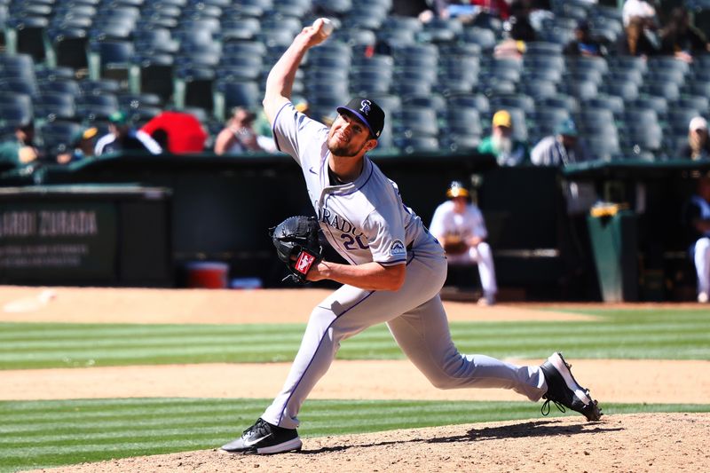 May 23, 2024; Oakland, California, USA; Colorado Rockies relief pitcher Peter Lambert (20) pitches the ball against the Oakland Athletics during the eleventh inning at Oakland-Alameda County Coliseum. Mandatory Credit: Kelley L Cox-USA TODAY Sports