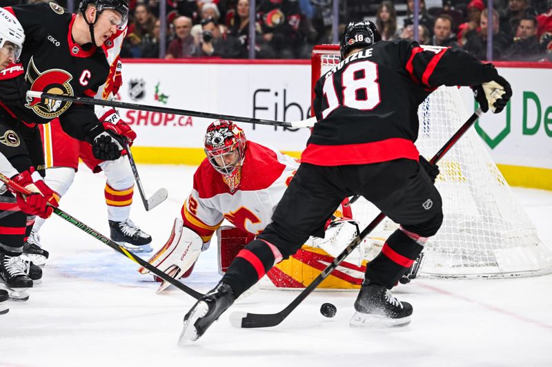 Nov 25, 2024; Ottawa, Ontario, CAN; Calgary Flames goalie Dustin Wolf (32) makes a save against Ottawa Senators center Tim Stutzle (18) during the third period at Canadian Tire Centre. Mandatory Credit: David Kirouac-Imagn Images