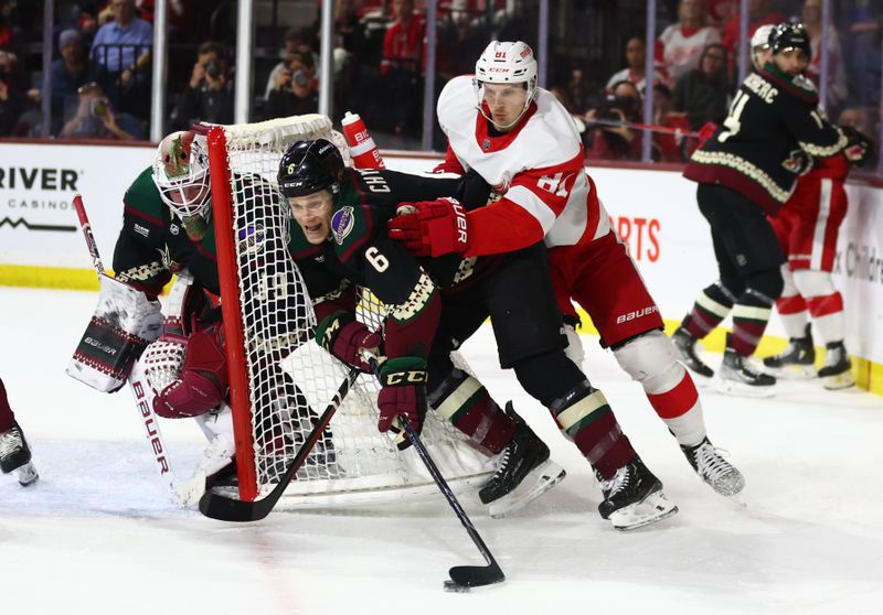 Jan 17, 2023; Tempe, Arizona, USA; Arizona Coyotes defenseman Jakob Chychrun (6) moves the puck against Detroit Red Wings left wing Dominik Kubalik (81) in the first period at Mullett Arena. Mandatory Credit: Mark J. Rebilas-USA TODAY Sports
