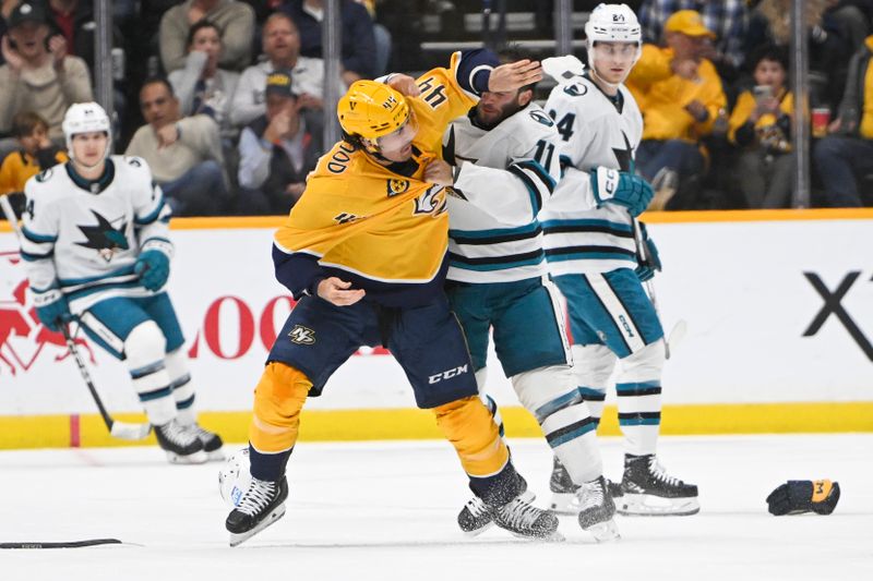 Oct 21, 2023; Nashville, Tennessee, USA; Nashville Predators left wing Kiefer Sherwood (44) and San Jose Sharks center Luke Kunin (11) exchange blows during the second period at Bridgestone Arena. Mandatory Credit: Steve Roberts-USA TODAY Sports