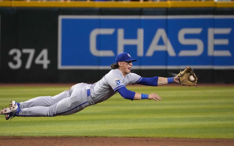 Apr 25, 2023; Phoenix, Arizona, USA; Kansas City Royals shortstop Bobby Witt Jr. (7) makes a diving catch against the Arizona Diamondbacks during the eighth inning at Chase Field. Mandatory Credit: Joe Camporeale-USA TODAY Sports