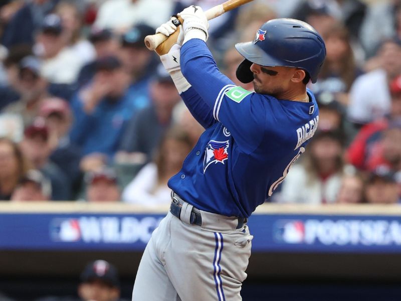 Oct 4, 2023; Minneapolis, Minnesota, USA; Toronto Blue Jays second baseman Cavan Biggio (8) hits a single in the sixth inning  against the Minnesota Twins during game two of the Wildcard series for the 2023 MLB playoffs at Target Field. Mandatory Credit: Jesse Johnson-USA TODAY Sports