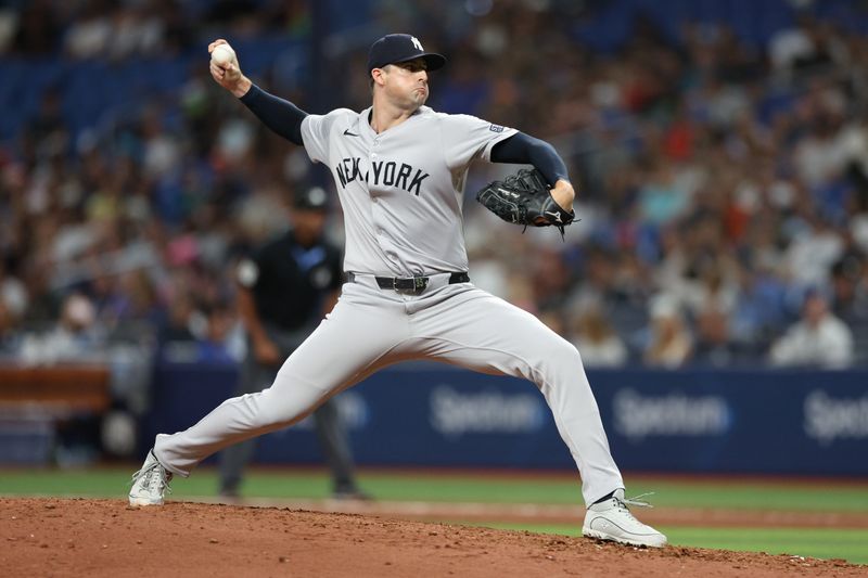 Jul 10, 2024; St. Petersburg, Florida, USA; New York Yankees pitcher Clay Holmes (35) throws a pitch against the Tampa Bay Rays in the eighth inning at Tropicana Field. Mandatory Credit: Nathan Ray Seebeck-USA TODAY Sports