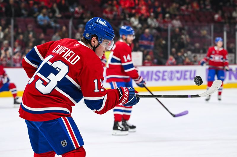 Nov 23, 2024; Montreal, Quebec, CAN; Montreal Canadiens right wing Cole Caufield (13) plays with a puck during warm-up before the game against the Las Vegas Golden Knights at Bell Centre. Mandatory Credit: David Kirouac-Imagn Images