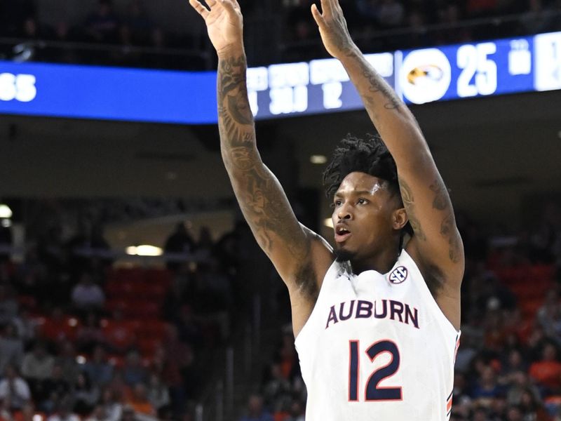 Feb 14, 2023; Auburn, Alabama, USA;  Auburn Tigers guard Zep Jasper (12) takes a 3-point shot against the Missouri Tigers during the second half at Neville Arena. Mandatory Credit: Julie Bennett-USA TODAY Sports