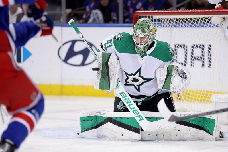 Feb 20, 2024; New York, New York, USA; Dallas Stars goaltender Scott Wedgewood (41) makes a save against New York Rangers left wing Alexis Lafreniere (13) during the third period at Madison Square Garden. Mandatory Credit: Brad Penner-USA TODAY Sports