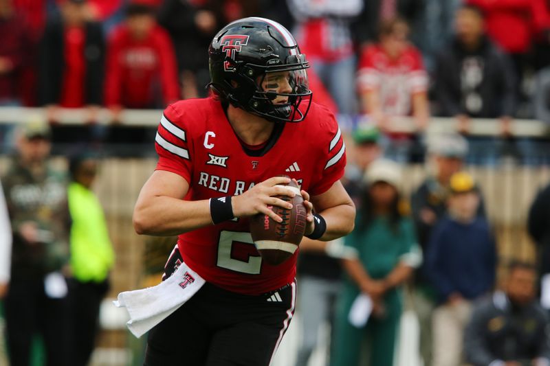 Oct 19, 2024; Lubbock, Texas, USA;  Texas Tech Red Raiders quarterback Behren Morton (2) drops back to pass against the Baylor Bears in the first half at Jones AT&T Stadium and Cody Campbell Field. Mandatory Credit: Michael C. Johnson-Imagn Images