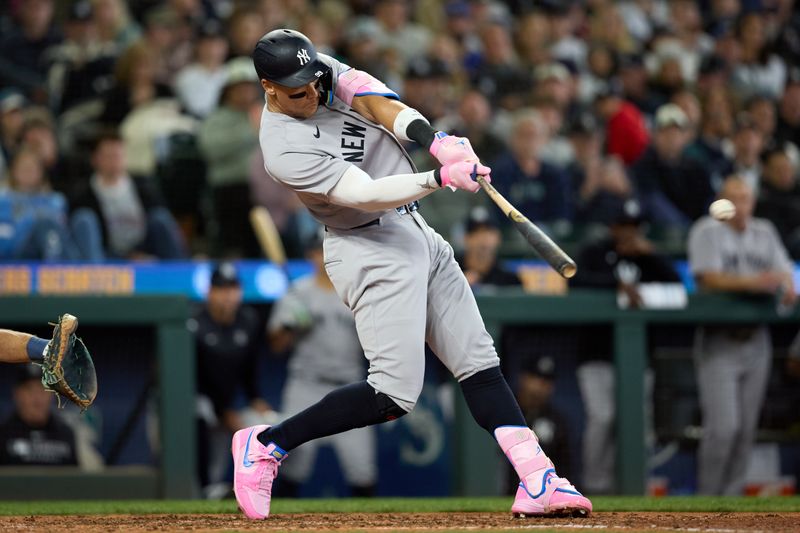 May 14, 2025; Seattle, Washington, USA; New York Yankees designated hitter Aaron Judge (99) hits a solo home run off Seattle Mariners pitcher Carlos Vargas (not pictured) during the eighth inning at T-Mobile Park. Mandatory Credit: John Froschauer-Imagn Images