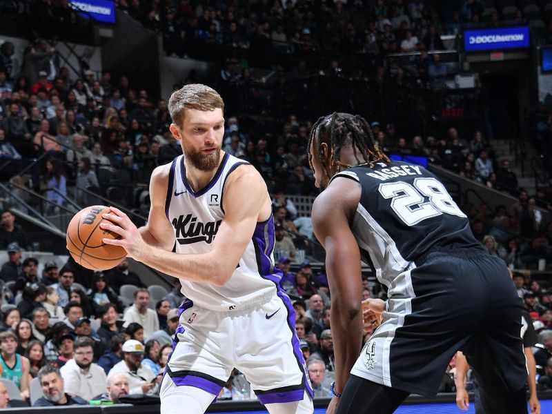 SAN ANTONIO, TX - DECEMBER 6: Domantas Sabonis #11 of the Sacramento Kings handles the ball during the game against the San Antonio Spurs on December 6, 2024 at the Frost Bank Center in San Antonio, Texas. NOTE TO USER: User expressly acknowledges and agrees that, by downloading and or using this photograph, user is consenting to the terms and conditions of the Getty Images License Agreement. Mandatory Copyright Notice: Copyright 2024 NBAE (Photos by Michael Gonzales/NBAE via Getty Images)