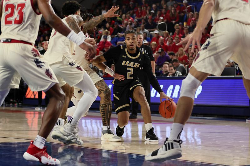 Jan 14, 2024; Boca Raton, Florida, USA; UAB Blazers guard Daniel Ortiz (2) drives to the basket against the Florida Atlantic Owls during the first half at Eleanor R. Baldwin Arena. Mandatory Credit: Sam Navarro-USA TODAY Sports