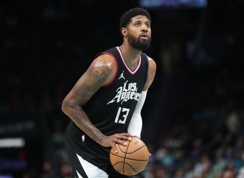 CHARLOTTE, NC - MARCH 31: Paul George #13 of the LA Clippers shoots a free throw during the game against the Charlotte Hornets on March 31, 2024 at Spectrum Center in Charlotte, North Carolina. NOTE TO USER: User expressly acknowledges and agrees that, by downloading and or using this photograph, User is consenting to the terms and conditions of the Getty Images License Agreement.  Mandatory Copyright Notice:  Copyright 2024 NBAE (Photo by Brock Williams-Smith/NBAE via Getty Images)