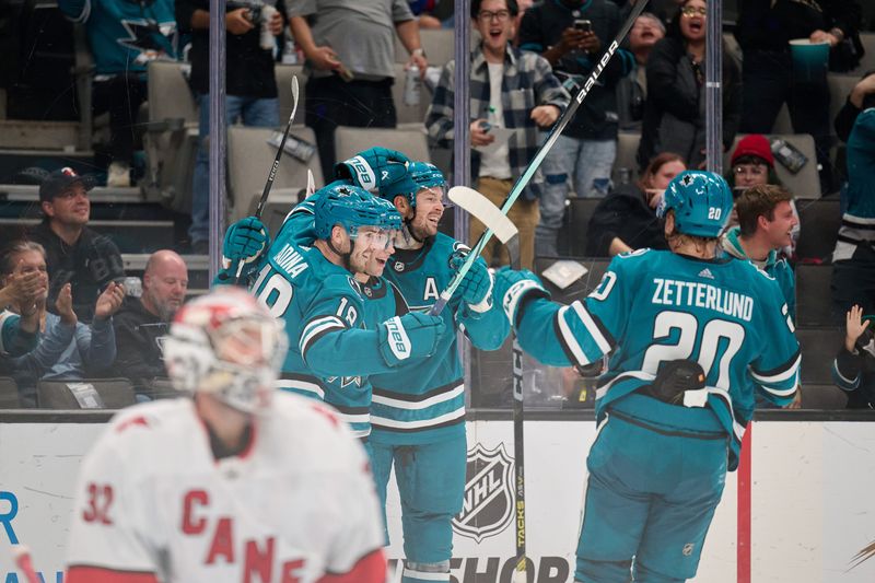 Oct 17, 2023; San Jose, California, USA; San Jose Sharks center William Eklund (72) celebrates with his teammates after scoring a goal against the Carolina Hurricanes during the second period at SAP Center at San Jose. Mandatory Credit: Robert Edwards-USA TODAY Sports