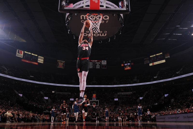 PORTLAND, OR - FEBRUARY 15: Jabari Walker #34 of the Portland Trail Blazers dunks the ball during the game against the Minnesota Timberwolves on February 15, 2024 at the Moda Center Arena in Portland, Oregon. NOTE TO USER: User expressly acknowledges and agrees that, by downloading and or using this photograph, user is consenting to the terms and conditions of the Getty Images License Agreement. Mandatory Copyright Notice: Copyright 2024 NBAE (Photo by Cameron Browne/NBAE via Getty Images)