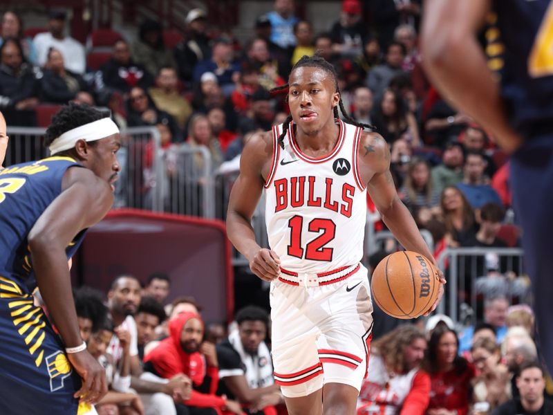 CHICAGO, IL - MARCH 27: Ayo Dosunmu #12 of the Chicago Bulls dribbles the ball during the game against the Indiana Pacers on March 27, 2024 at United Center in Chicago, Illinois. NOTE TO USER: User expressly acknowledges and agrees that, by downloading and or using this photograph, User is consenting to the terms and conditions of the Getty Images License Agreement. Mandatory Copyright Notice: Copyright 2024 NBAE (Photo by Jeff Haynes/NBAE via Getty Images)