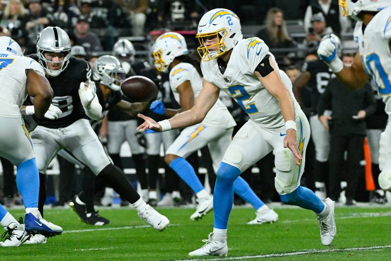 Los Angeles Chargers quarterback Easton Stick (2) throws a pass against the Las Vegas Raiders during the first half of an NFL football game, Thursday, Dec. 14, 2023, in Las Vegas. (AP Photo/David Becker)