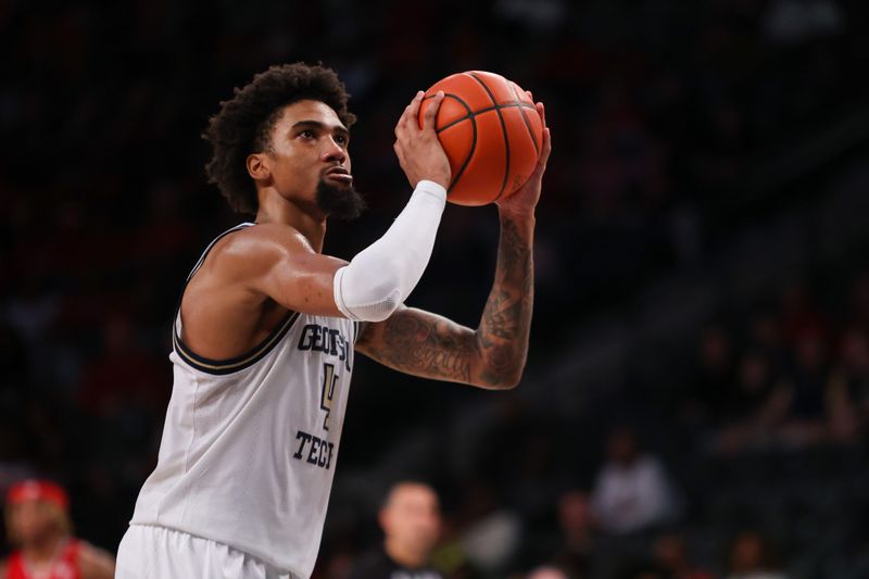 Feb 25, 2023; Atlanta, Georgia, USA; Georgia Tech Yellow Jackets forward Javon Franklin (4) shoots a free throw against the Louisville Cardinals in the second half at McCamish Pavilion. Mandatory Credit: Brett Davis-USA TODAY Sports