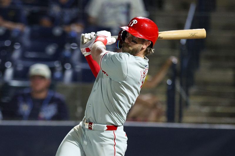 May 6, 2025; Tampa, Florida, USA; Philadelphia Phillies first baseman Bryce Harper (3) hits a single against the Tampa Bay Rays in the ninth inning at George M. Steinbrenner Field. Mandatory Credit: Nathan Ray Seebeck-Imagn Images