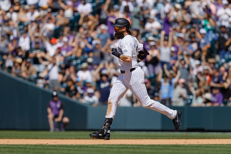 May 27, 2024; Denver, Colorado, USA; Colorado Rockies right fielder Charlie Blackmon (19) rounds the bases on a three run home run in the fourth inning against the Cleveland Guardians at Coors Field. Mandatory Credit: Isaiah J. Downing-USA TODAY Sports