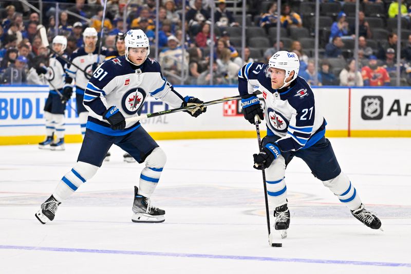 Nov 7, 2023; St. Louis, Missouri, USA;  Winnipeg Jets left wing Nikolaj Ehlers (27) controls the puck against the St. Louis Blues during the third period at Enterprise Center. Mandatory Credit: Jeff Curry-USA TODAY Sports