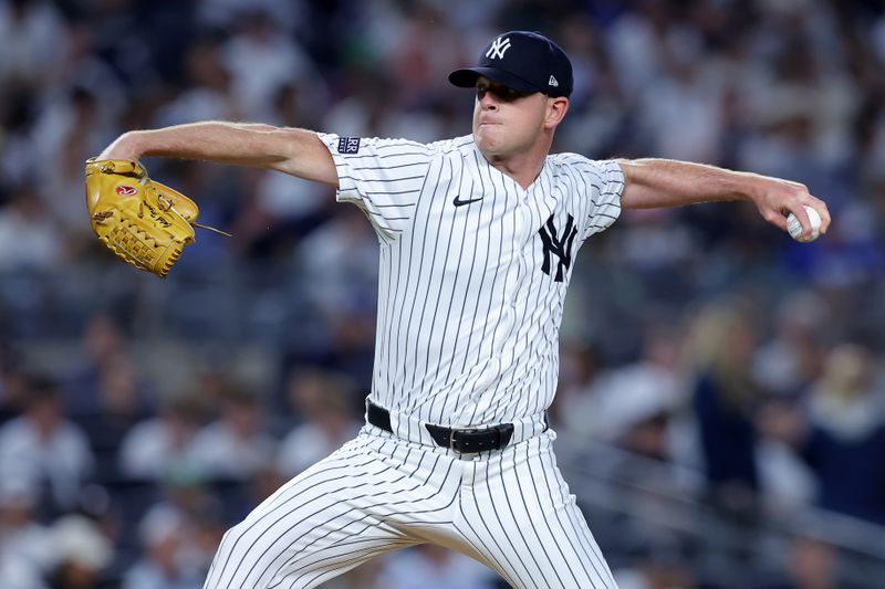 Jun 9, 2024; Bronx, New York, USA; New York Yankees relief pitcher Caleb Ferguson (64) pitches against the Los Angeles Dodgers during the sixth inning at Yankee Stadium. Mandatory Credit: Brad Penner-USA TODAY Sports