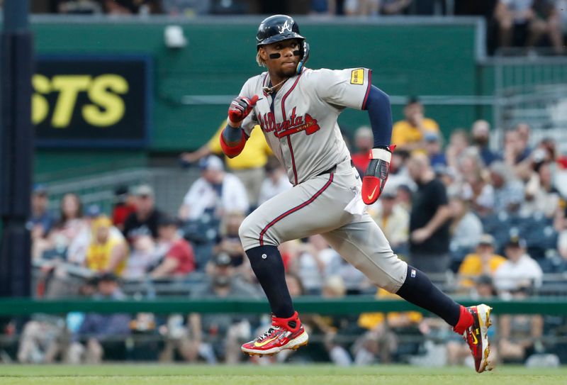 May 25, 2024; Pittsburgh, Pennsylvania, USA;  Atlanta Braves right fielder Ronald Acuña Jr. (13) runs on his way to stealing second base against the Pittsburgh Pirates during the fifth inning at PNC Park. Mandatory Credit: Charles LeClaire-USA TODAY Sports