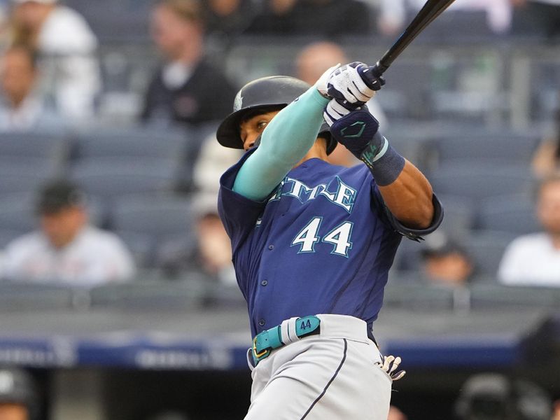 Jun 22, 2023; Bronx, New York, USA; Seattle Mariners center fielder Julio Rodriguez (44) hits a single against the New York Yankees during the first inning at Yankee Stadium. Mandatory Credit: Gregory Fisher-USA TODAY Sports