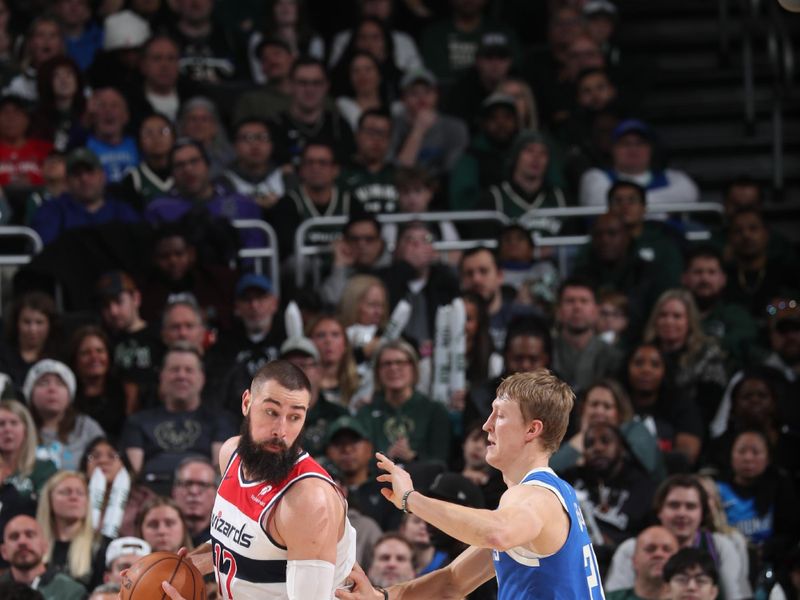 MILWAUKEE, WI - NOVEMBER 30: Jonas Valanciunas #17 of the Washington Wizards handles the ball during the game against the Milwaukee Bucks on November 30, 2024 at Fiserv Forum Center in Milwaukee, Wisconsin. NOTE TO USER: User expressly acknowledges and agrees that, by downloading and or using this Photograph, user is consenting to the terms and conditions of the Getty Images License Agreement. Mandatory Copyright Notice: Copyright 2024 NBAE (Photo by Gary Dineen/NBAE via Getty Images).