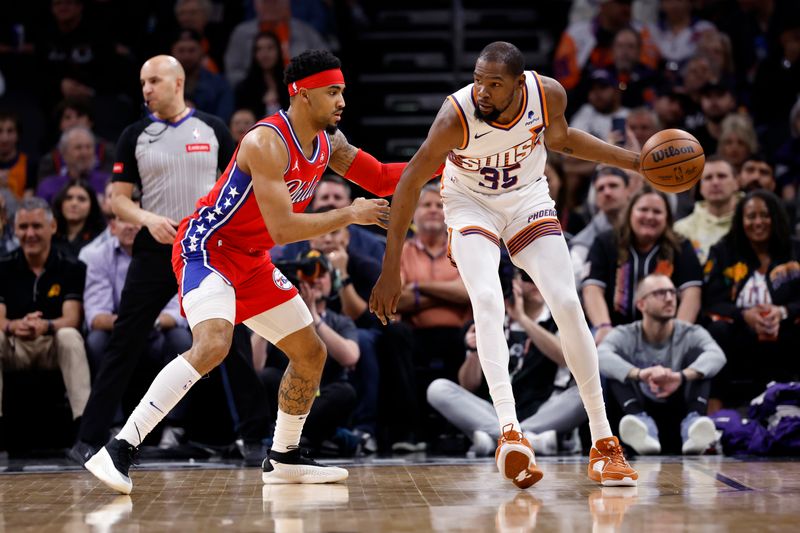 PHOENIX, ARIZONA - MARCH 20: Kevin Durant #35 of the Phoenix Suns posts up on KJ Martin #1 of the Philadelphia 76ers during the first half at Footprint Center on March 20, 2024 in Phoenix, Arizona. NOTE TO USER: User expressly acknowledges and agrees that, by downloading and or using this photograph, User is consenting to the terms and conditions of the Getty Images License Agreement.  (Photo by Chris Coduto/Getty Images)