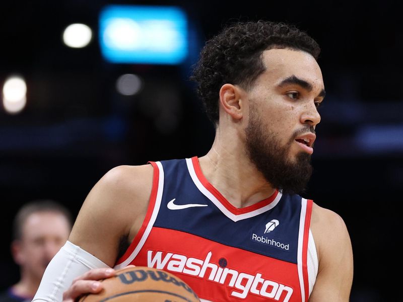 WASHINGTON, DC - JANUARY 31: Tyus Jones #5 of the Washington Wizards dribbles against the LA Clippers during first half at Capital One Arena on January 31, 2024 in Washington, DC. NOTE TO USER: User expressly acknowledges and agrees that, by downloading and or using this photograph, User is consenting to the terms and conditions of the Getty Images License Agreement.  (Photo by Patrick Smith/Getty Images)