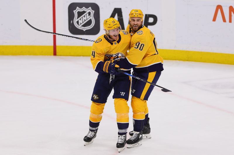 Mar 21, 2024; Sunrise, Florida, USA; Nashville Predators center Gustav Nyquist (14) and center Ryan O'Reilly (90) celebrates after a goal by left wing Filip Forsberg (not pictured) against the Florida Panthers during the third period at Amerant Bank Arena. Mandatory Credit: Sam Navarro-USA TODAY Sports