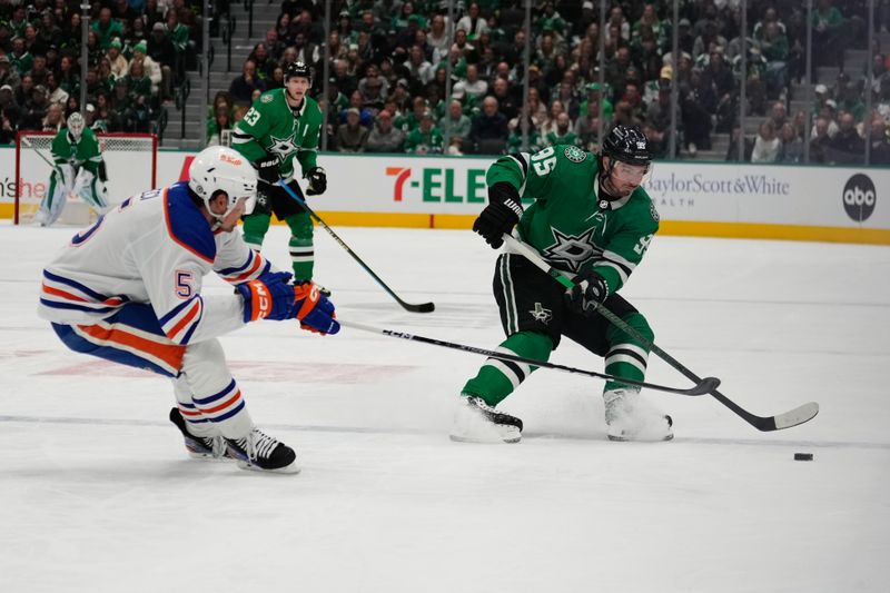 Feb 17, 2024; Dallas, Texas, USA; Dallas Stars center Matt Duchene (95) skates with the puck against Edmonton Oilers defenseman Cody Ceci (5) during the second period at American Airlines Center. Mandatory Credit: Chris Jones-USA TODAY Sports