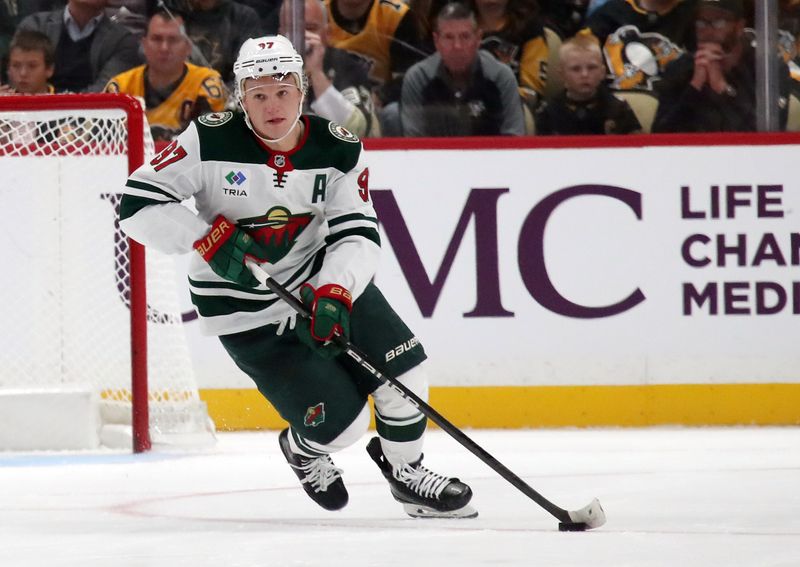 Oct 29, 2024; Pittsburgh, Pennsylvania, USA; Minnesota Wild left wing Kirill Kaprizov (97) skates up ice with the puck against the Pittsburgh Penguins during the second period at PPG Paints Arena. Mandatory Credit: Charles LeClaire-Imagn Images