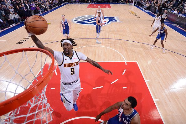 SACRAMENTO, CA - DECEMBER 2: Kentavious Caldwell-Pope #5 of the Denver Nuggets drives to the basket during the game against the Sacramento Kings on December 2, 2023 at Golden 1 Center in Sacramento, California. NOTE TO USER: User expressly acknowledges and agrees that, by downloading and or using this Photograph, user is consenting to the terms and conditions of the Getty Images License Agreement. Mandatory Copyright Notice: Copyright 2023 NBAE (Photo by Rocky Widner/NBAE via Getty Images)