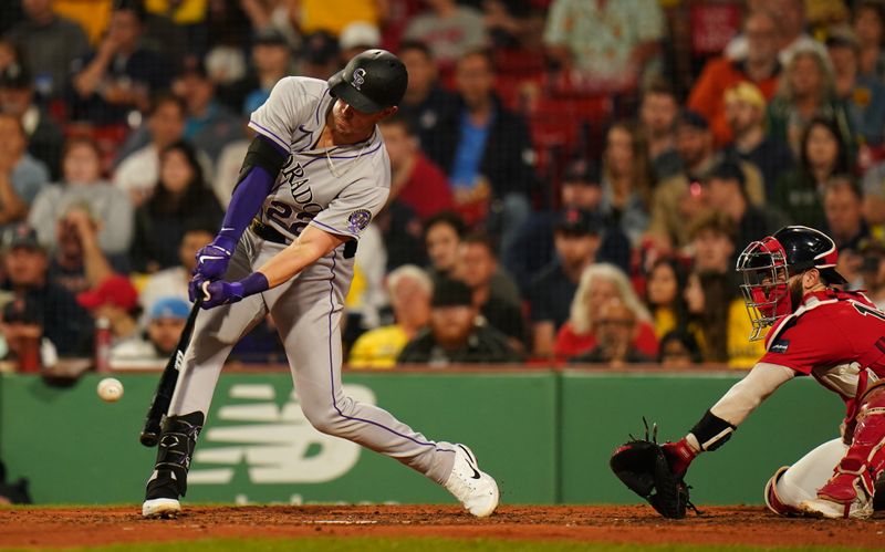 Jun 14, 2023; Boston, Massachusetts, USA; Colorado Rockies first baseman Nolan Jones (22) gets a hit against the Boston Red Sox in the sixth inning at Fenway Park. Mandatory Credit: David Butler II-USA TODAY Sports