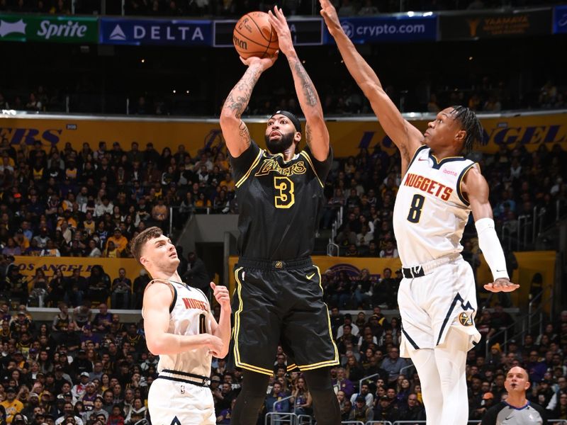 LOS ANGELES, CA - FEBRUARY 8: Anthony Davis #3 of the Los Angeles Lakers shoots the ball during the game against the Denver Nuggets on Feburary 8, 2024 at Crypto.Com Arena in Los Angeles, California. NOTE TO USER: User expressly acknowledges and agrees that, by downloading and/or using this Photograph, user is consenting to the terms and conditions of the Getty Images License Agreement. Mandatory Copyright Notice: Copyright 2024 NBAE (Photo by Andrew D. Bernstein/NBAE via Getty Images)