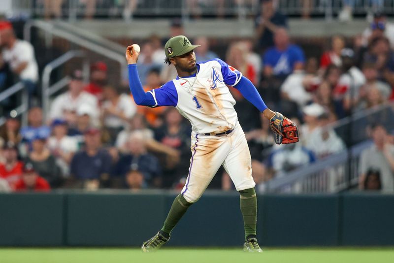 May 20, 2023; Atlanta, Georgia, USA; Atlanta Braves second baseman Ozzie Albies (1) throws a runner out at first against the Seattle Mariners in the sixth inning at Truist Park. Mandatory Credit: Brett Davis-USA TODAY Sports
