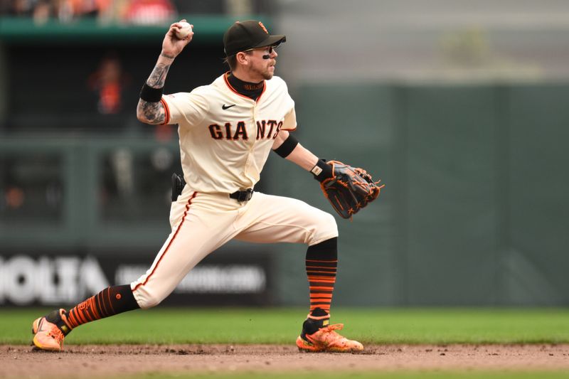 Sep 28, 2025; San Francisco, California, USA;  San Francisco Giants second baseman Christian Koss (50) throws to second base for an out against the Colorado Rockies in the eighth inning at Oracle Park. Mandatory Credit: Eakin Howard-Imagn Images