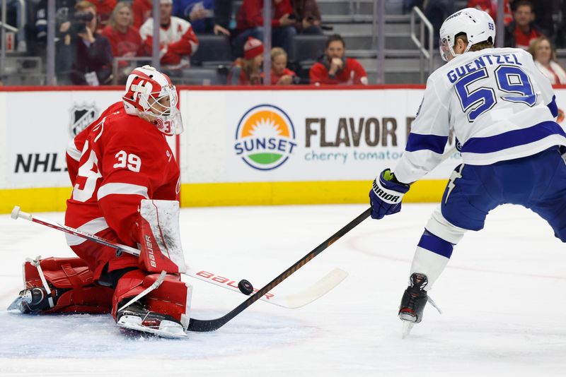 Jan 25, 2025; Detroit, Michigan, USA;  Detroit Red Wings goaltender Cam Talbot (39) makes a save on Tampa Bay Lightning center Jake Guentzel (59) in the first period at Little Caesars Arena. Mandatory Credit: Rick Osentoski-Imagn Images