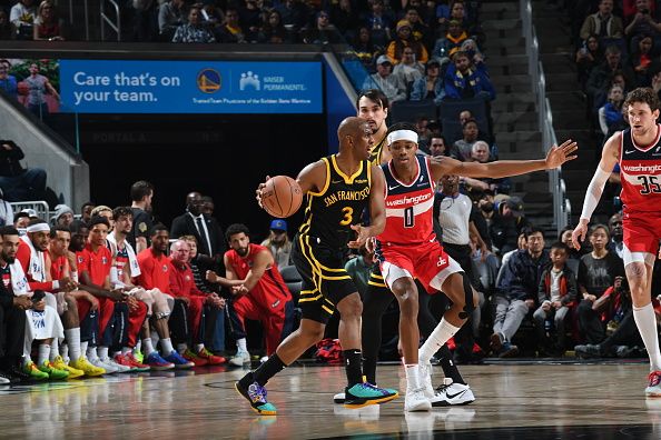 SAN FRANCISCO, CA - DECEMBER 22: Chris Paul #3 of the Golden State Warriors dribbles the ball during the game against the Washington Wizards on December 22, 2023 at Chase Center in San Francisco, California. NOTE TO USER: User expressly acknowledges and agrees that, by downloading and or using this photograph, user is consenting to the terms and conditions of Getty Images License Agreement. Mandatory Copyright Notice: Copyright 2023 NBAE (Photo by Noah Graham/NBAE via Getty Images)