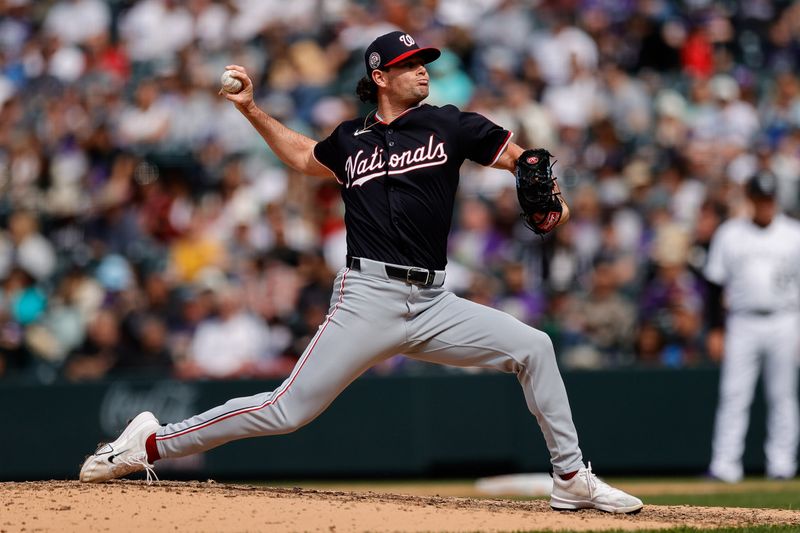 Apr 20, 2025; Denver, Colorado, USA; Washington Nationals relief pitcher Kyle Finnegan (67) pitches in the ninth inning against the Colorado Rockies at Coors Field. Mandatory Credit: Isaiah J. Downing-Imagn Images