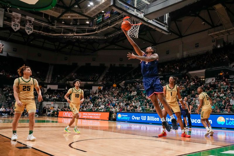 Jan 6, 2024; Charlotte, North Carolina, USA; Florida Atlantic Owls forward Giancarlo Rosado (3) scores a fast break layup against the Charlotte 49ers during the second half at Dale F. Halton Arena. Mandatory Credit: Jim Dedmon-USA TODAY Sports