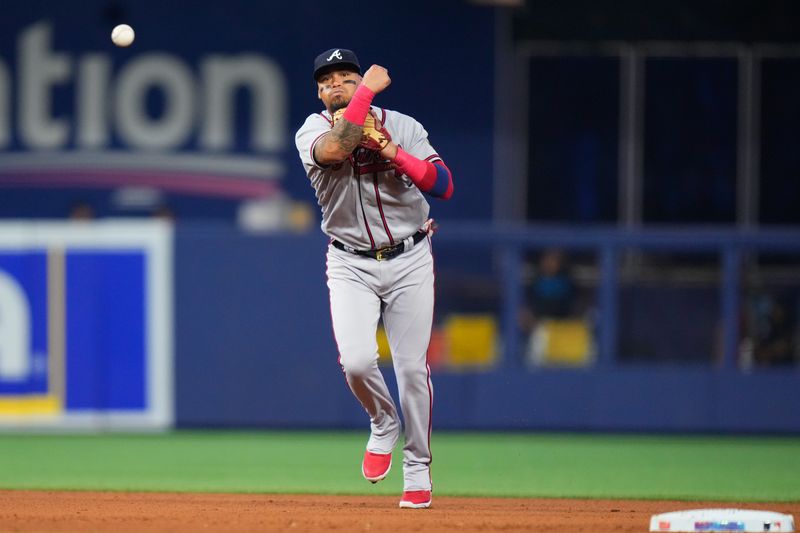 Sep 17, 2023; Miami, Florida, USA; Atlanta Braves shortstop Orlando Arcia (11) throws the ball to first base against the Miami Marlins during the fourth inning at loanDepot Park. Mandatory Credit: Rich Storry-USA TODAY Sports