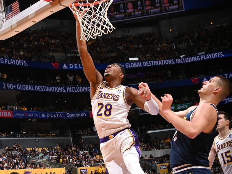 LOS ANGELES, CA - APRIL 27: Rui Hachimura #28 of the Los Angeles Lakers drives to the basket during the game against the Denver Nuggets during Round 1 Game 4 of the 2024 NBA Playoffs on April 27, 2024 at Crypto.Com Arena in Los Angeles, California. NOTE TO USER: User expressly acknowledges and agrees that, by downloading and/or using this Photograph, user is consenting to the terms and conditions of the Getty Images License Agreement. Mandatory Copyright Notice: Copyright 2024 NBAE (Photo by Andrew D. Bernstein/NBAE via Getty Images)