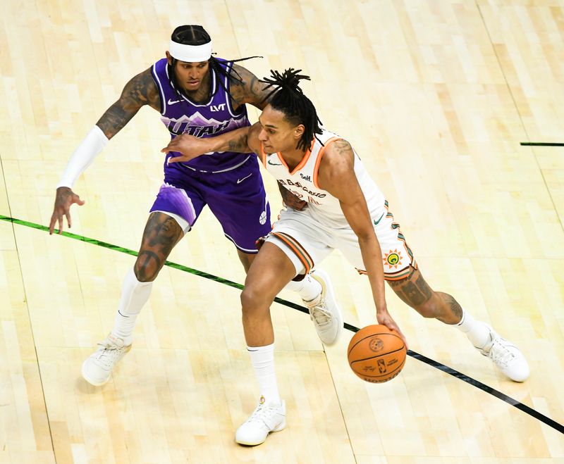 SALT LAKE CITY, UTAH - FEBRUARY 25: Devin Vassell #24 of the San Antonio Spurs drives into Jordan Clarkson #00 of the Utah Jazz during the first half at Delta Center on February 25, 2024 in Salt Lake City, Utah. NOTE TO USER: User expressly acknowledges and agrees that, by downloading and or using this photograph, User is consenting to the terms and conditions of the Getty Images License Agreement. (Photo by Alex Goodlett/Getty Images)