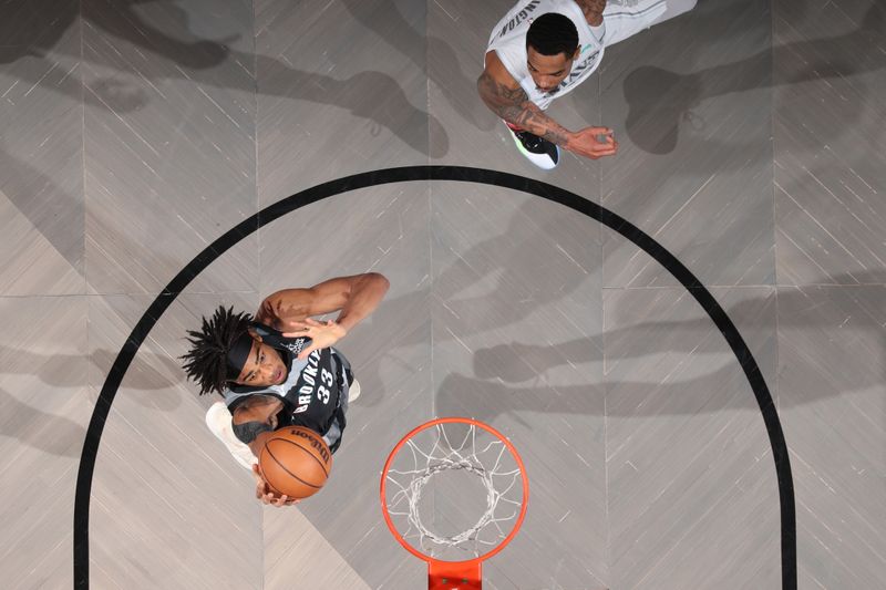 BROOKLYN, NY - MARCH 24: Nicolas Claxton #33 of the Brooklyn Nets drives to the basket during the game against the Dallas Mavericks on March 24, 2025 at Barclays Center in Brooklyn, New York. NOTE TO USER: User expressly acknowledges and agrees that, by downloading and or using this Photograph, user is consenting to the terms and conditions of the Getty Images License Agreement. Mandatory Copyright Notice: Copyright 2025 NBAE (Photo by Nathaniel S. Butler/NBAE via Getty Images)