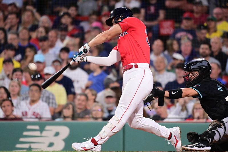 Aug 23, 2024; Boston, Massachusetts, USA; Boston Red Sox outfielder Rob Refsnyder (30) hits a home run against the Arizona Diamondbacks during the sixth inning at Fenway Park. Mandatory Credit: Eric Canha-USA TODAY Sports