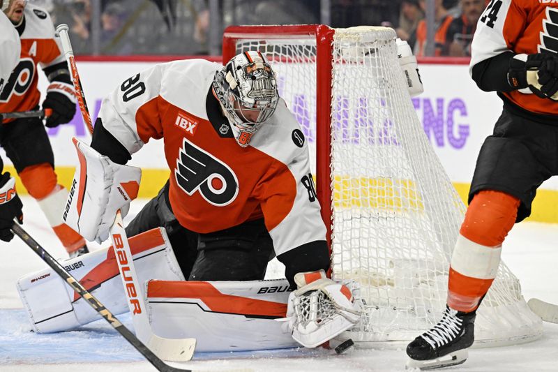 Nov 20, 2025; Philadelphia, Pennsylvania, USA; Philadelphia Flyers goaltender Dan Vladar (80) covers the puck against the St. Louis Blues during the second period at Xfinity Mobile Arena. Mandatory Credit: Eric Hartline-Imagn Images