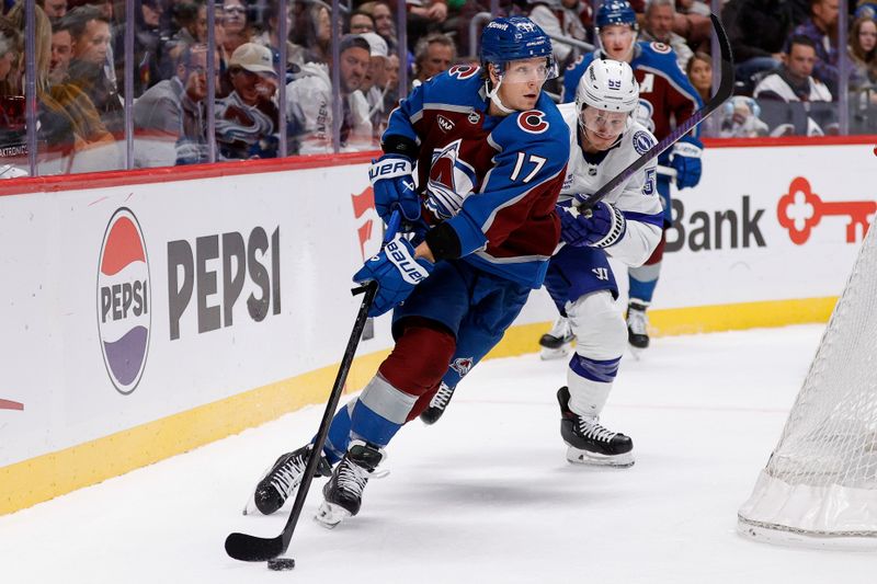 Oct 30, 2024; Denver, Colorado, USA; Colorado Avalanche center Parker Kelly (17) controls the puck ahead of Tampa Bay Lightning center Jake Guentzel (59) in the first period at Ball Arena. Mandatory Credit: Isaiah J. Downing-Imagn Images